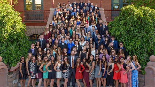 people posing for photograph on Old Main stairs